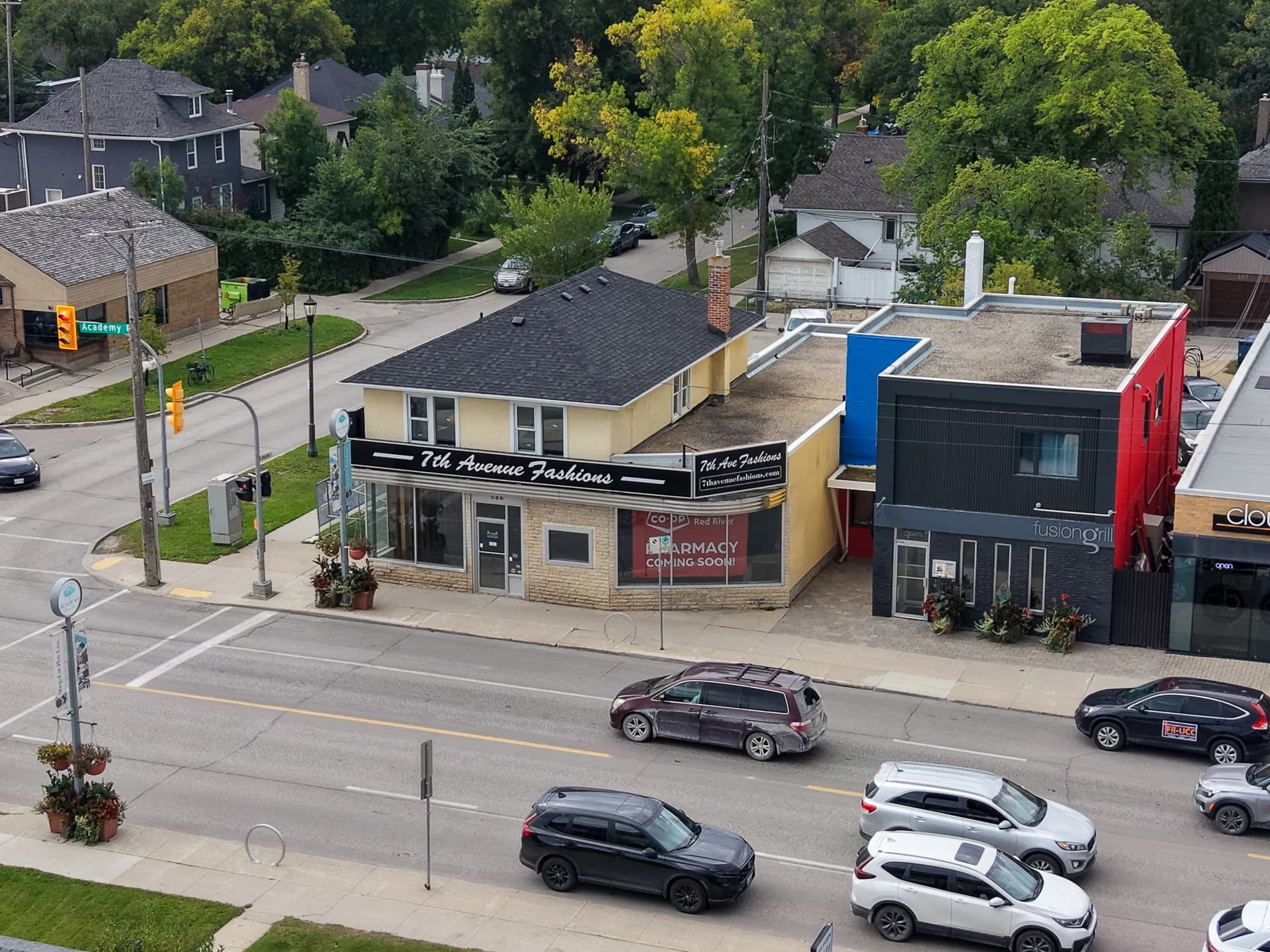 Aerial view of the Co-op Academy Pharmacy project on Academy Road, with Red River Co-op pharmacy signage in the storefront window