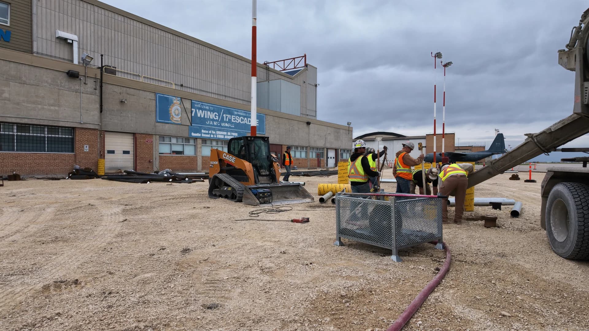 Crew carrying out concrete ramp replacement outside Hangar 16 at 17 Wing Winnipeg